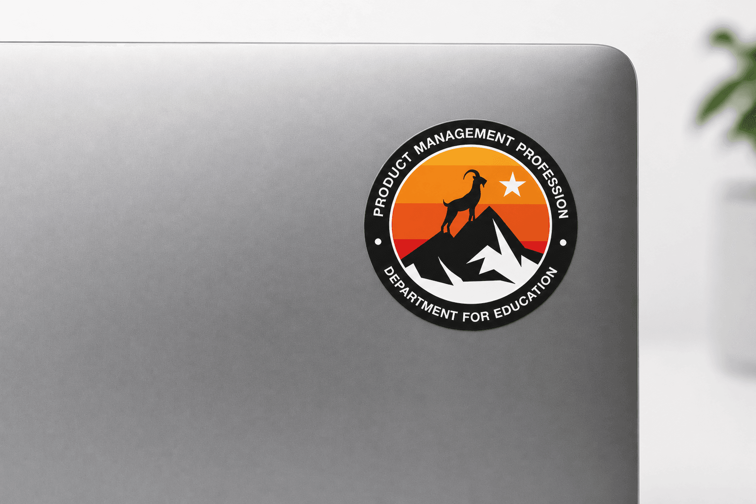 Mission patch for product management profession. A patch in the shape of a circle, with a goat stood on top of a mountain looking towards the North Star.